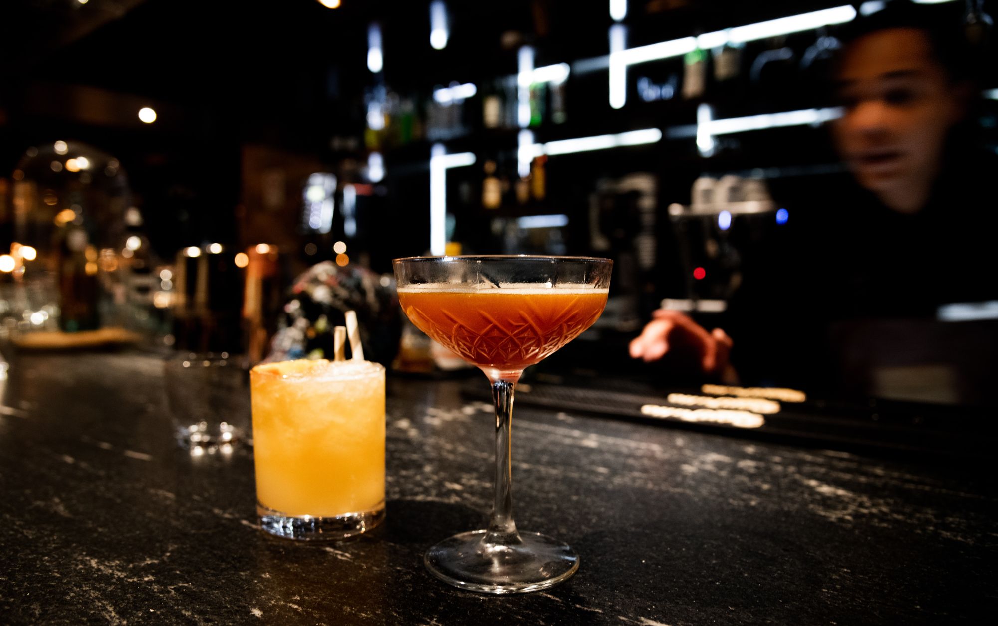 Cocktail making in bar at night 