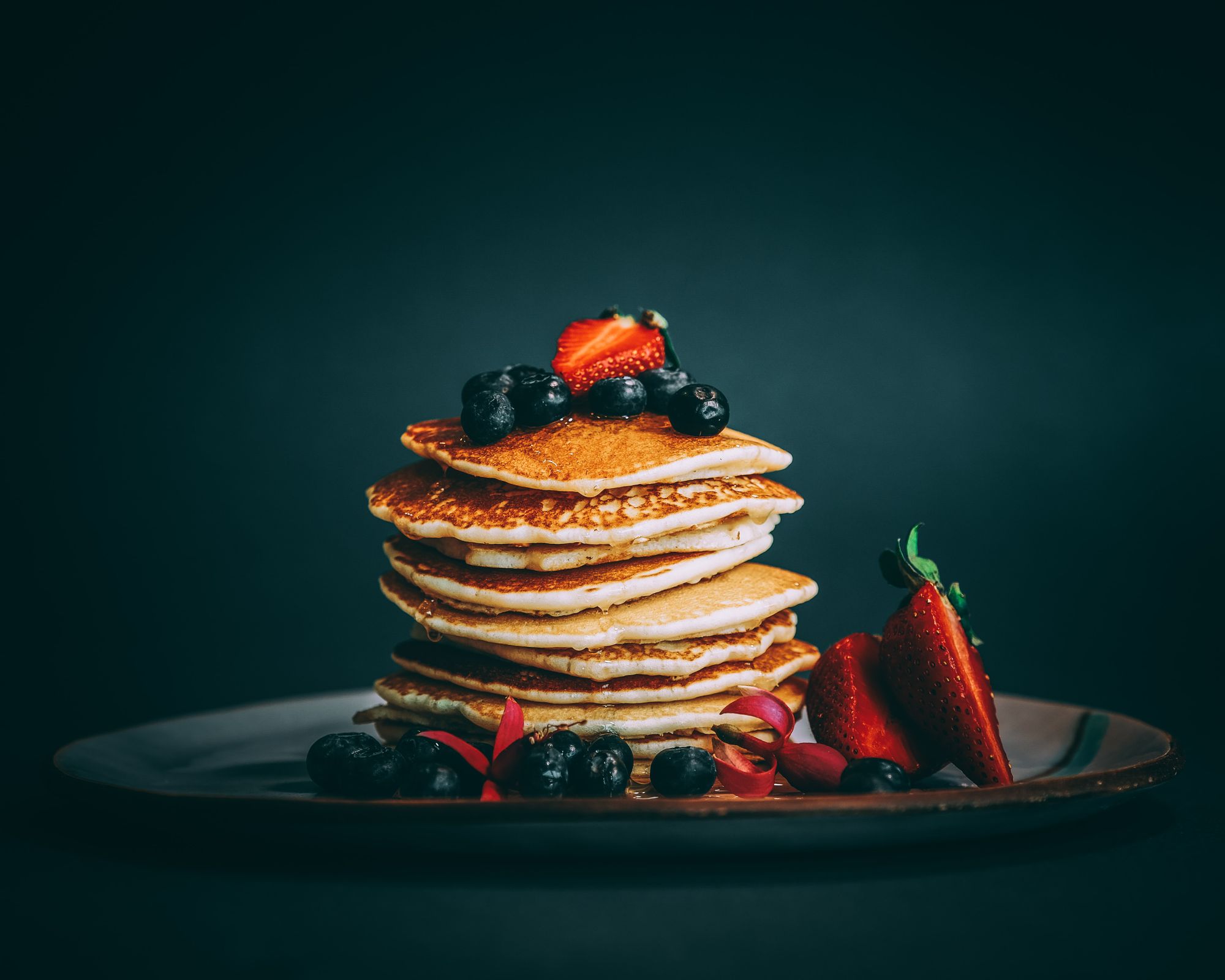 Pancakes with blueberries and strawberries