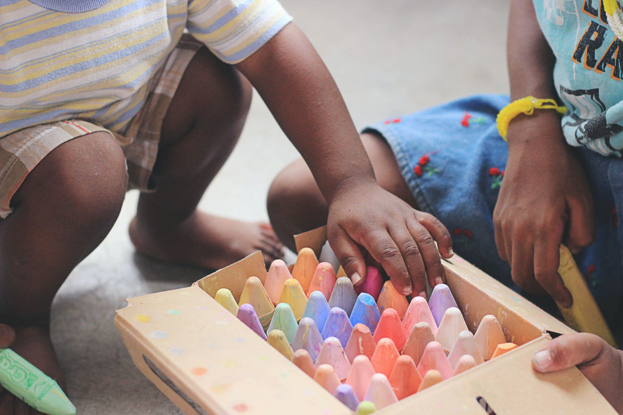 Children playing with coloring pencils