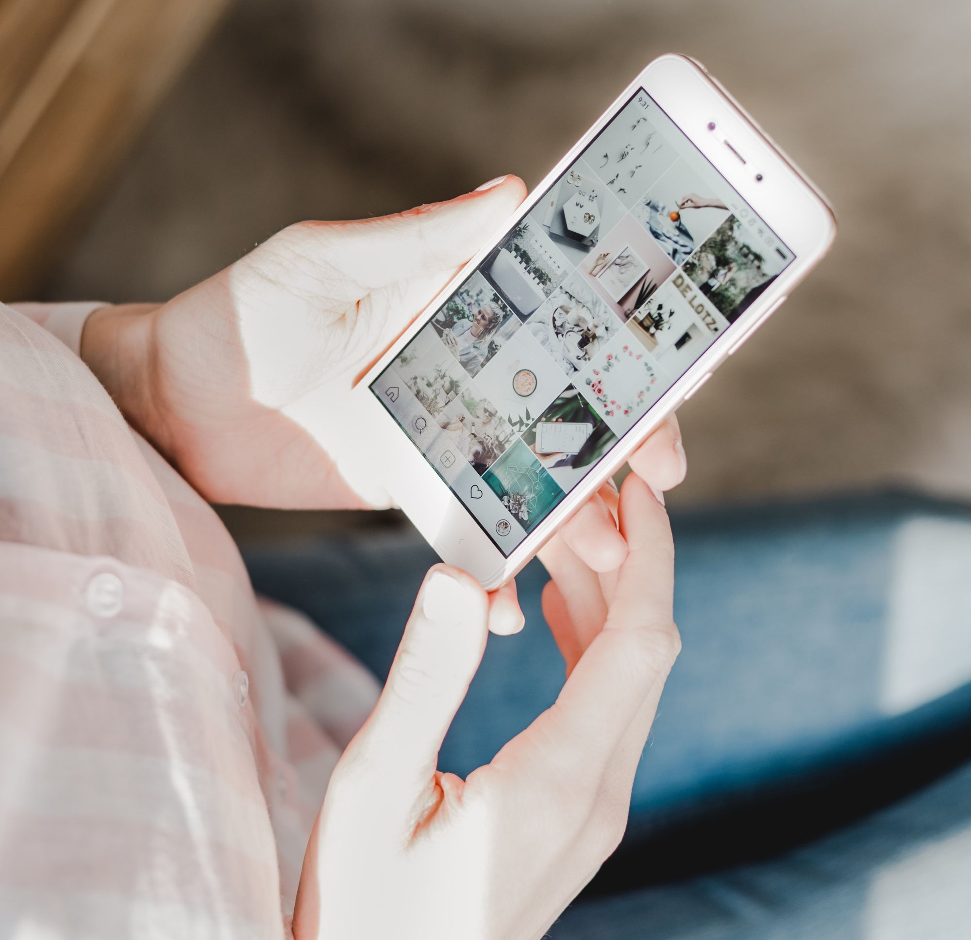 Hands holding phone up with Instagram as online presence